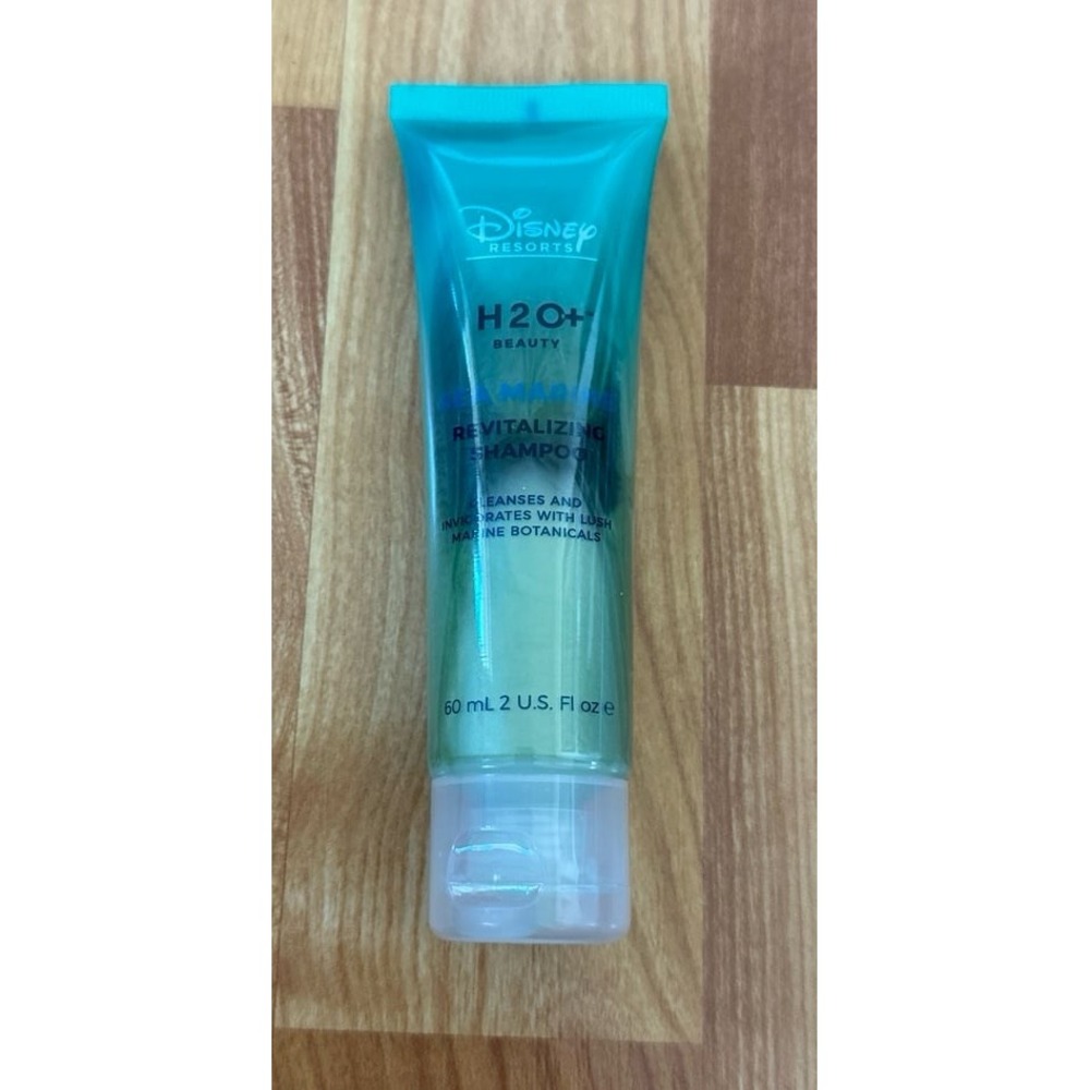 Disney H2O+ Beauty Sea Marine Revitalizing Shampoo travel-size‎ bottle.